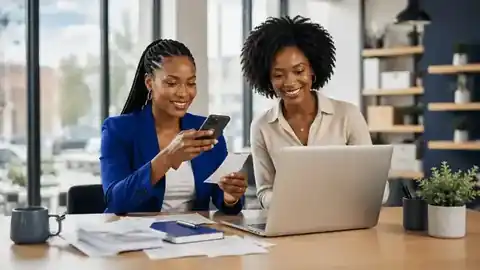 Two professionals scanning a receipt and uploading financial records